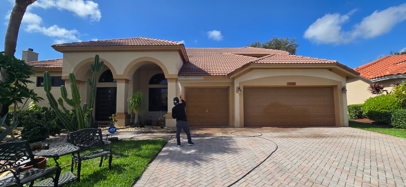 Pressure washing/Pressure Cleaning a residential home located at  Boynton Beach, FL 33472